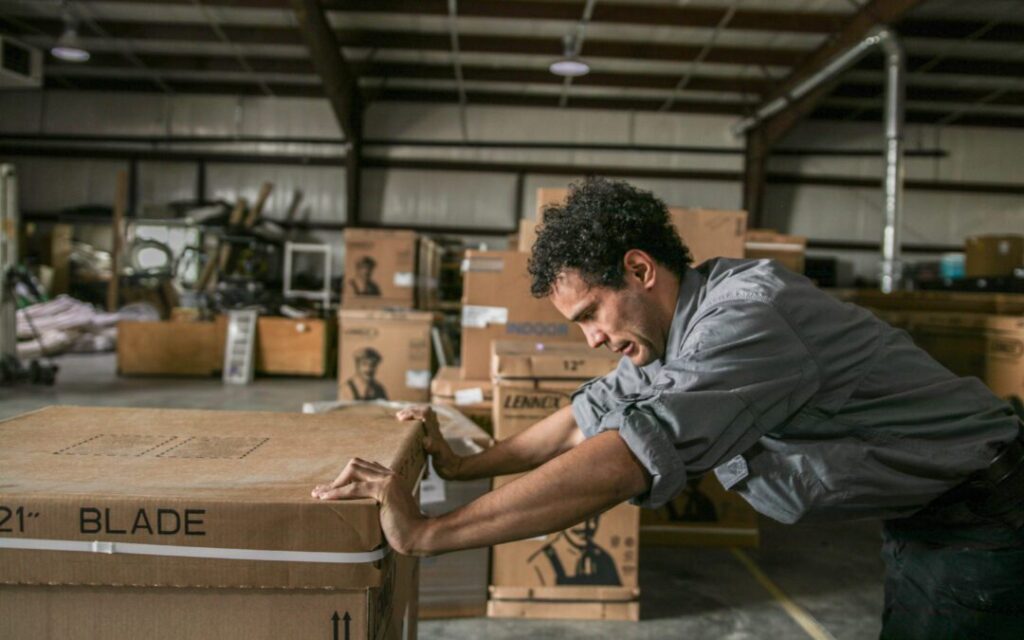 man pushing a package