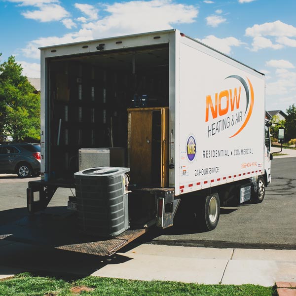 unloading HVAC unit from truck